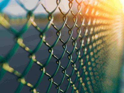 fence with metal grid in perspective, background